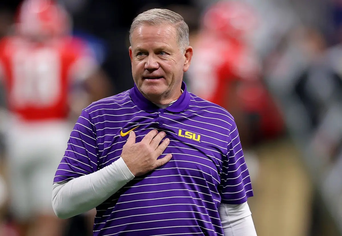 Cover Image for No one expected him to sing it — but head coach Brian Kelly’s National Anthem just brought the entire stadium to tears.  He is known for his sharp mind, his disciplined approach to the game, and the unwavering leadership he brings to the LSU Tigers. But when Brian Kelly stepped up to the microphone, everything suddenly stopped.  His voice didn’t shake the stadium with volume, but with heart. The anthem wasn’t just sung. It was lived.  Fans stood up. Some cried. And now, the clip is spreading like wildfire, with many calling it the most emotional moment of the season.  So what made this performance strike such a different chord? And why are people saying Brian Kelly just redefined patriotism in a single song?