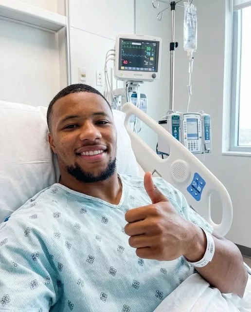 Cover Image for 🚨 15 MINUTES AGO: Saquon Barkley Breaks Silence from Hospital Bed 😳👇  Fans were left stunned as Saquon Barkley shared his first photo from a hospital bed, confirming weeks of swirling rumors. The Eagles star revealed he had quietly undergone a private medical treatment—and thankfully, the early results are positive.  But what truly shocked everyone was his emotional message: “This is only the beginning.” Soon after, a team statement hinted at a much deeper battle happening behind the scenes, leaving fans both worried and desperate for answers.  What has Barkley really been going through all this time?  👉 Read the full story in the comments before more details are revealed…