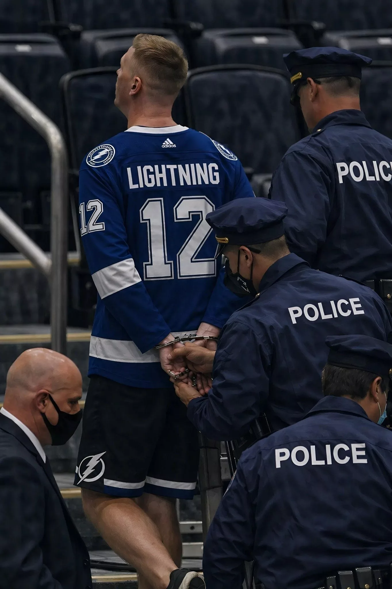 Cover Image for A fan of the Tampa Bay Lightning has been arrested and escorted out of the arena by police after attacking a fan of the Montreal Canadiens immediately following the classic rivalry game between the two teams in Round 5 of the Playoffs.