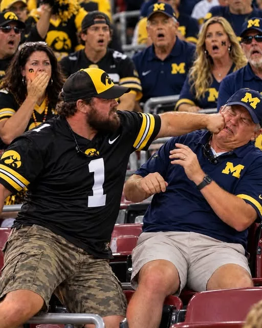 Cover Image for 🚨 SHOCKING VIDEO: Footage Appears to Show Iowa Hawkeyes Fan Hitting Michigan Wolverines Fan in Violent Postgame Brawl After 20–19 Thriller [VIDEO]