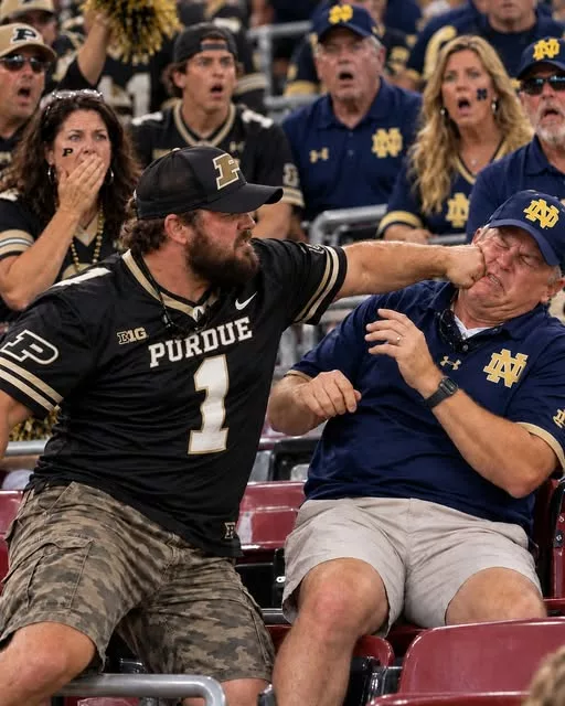 Cover Image for 🚨 SHOCKING VIDEO: Footage Appears to Show Purdue Boilermakers Fan Hitting Notre Dame Fighting Irish Fan in Violent Postgame Brawl After 10–49 Loss [VIDEO]